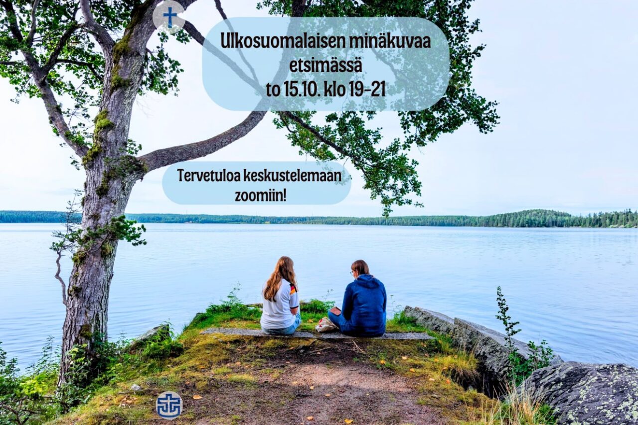 Kaksi ihmistä istumassa vierekkäin koivun alla, niemenkärjessä.
